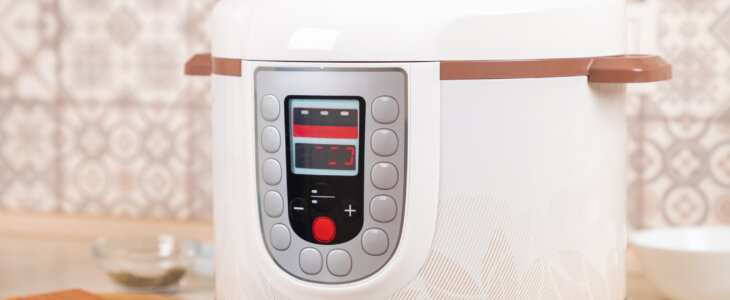 White pressure cooker on kitchen counter