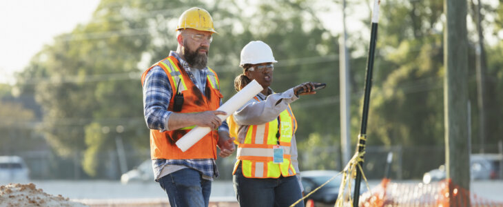 Construction workers surveying a site