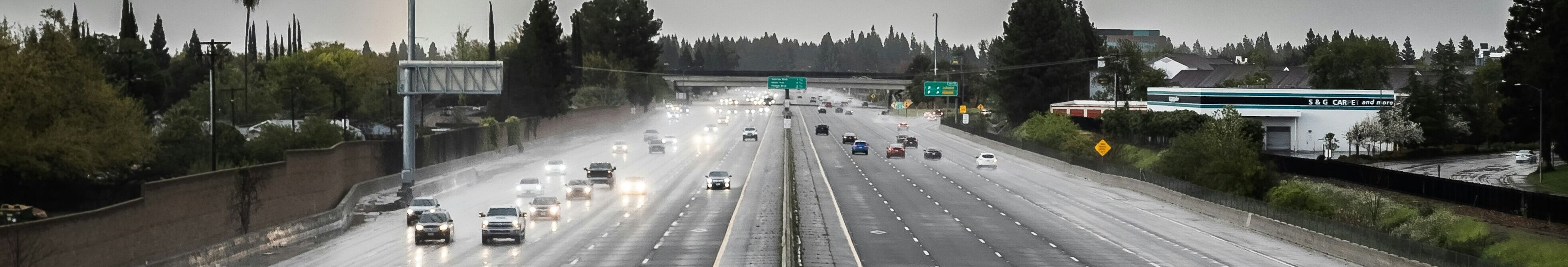 a rainy california highway with cars approaching